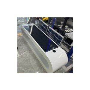 Modern white curved solar smart bench featuring integrated solar panels on the seat, USB charging ports, and wireless charging pads for public spaces.